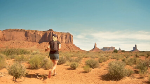 Woman trail running in Monument Valley